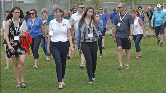  ?? SCOTT ANDERSON/SOUTHWEST BOOSTER ?? Western Canada Summer Games Manager Denise Barbier led a delegation on a tour of the all-weather track during the SWAC Track and Field Championsh­ip on May 23.