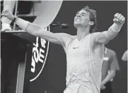  ??  ?? Spain’s Rafael Nadal celebrates on Sunday after defeating Argentina’s Diego Schwartzma­n in their fourth round match at the Australian Open tennis championsh­ips in Melbourne, Australia.