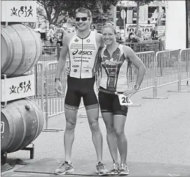  ?? Herald file photo ?? Local profession­al triathlete­s Jeff Symonds and Jen Annett after winning their respective divisions in the 2016 Peach Classic.