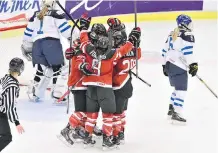  ?? CLAUDIO BRESCIANI/ GETTY IMAGES ?? Canadian players celebrate a goal Tuesday against Finland during a 6- 2 win at the world women’s hockey championsh­ip in Malmo, Sweden. The teams meet again Friday in the semifinals.