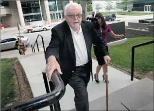  ??  ?? Rev. William Hodgson Marshall makes his way into Superior Court in June 2011. The retired Basilian priest pleaded guilty to molesting 16 boys and one girl in Ontario communitie­s where he served, dating back to the 1950s. Marshall will be released...