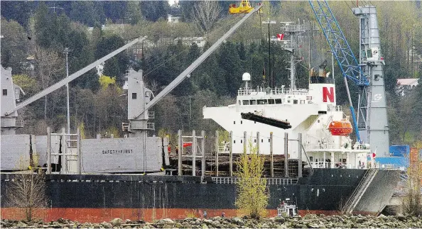  ?? — STUART DAVIS / POSTMEDIA FILES ?? Raw logs are loaded onto a ship at the Surrey Fraser Docks for export abroad. Retired UBC resource economist Peter Pearse argues that restrictio­ns on exports constrain the demand for B.C. logs, thereby depressing the domestic market price.