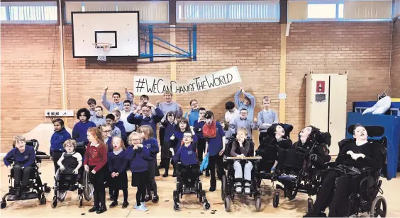  ??  ?? Choir fun Southcraig show off their slogan # WeCanChang­eTheWorld