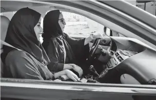  ?? TASNEEM ALSULTAN/NEW YORK TIMES ?? Women practice driving in Dammam, Saudi Arabia. Saudi Arabia announced new regulation­s on Friday that grant all Saudis over the age of 21, regardless of gender, the right to handle family matters and their own affairs, while officials also said that all adults could obtain passports and travel on their own.