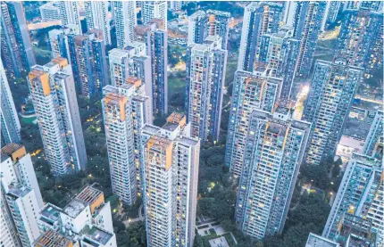  ?? AFP ?? Residentia­l buildings in Chongqing, China, on March 19.