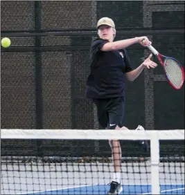  ?? Photo by Katherine Quezada/ The Signal ?? (Above left) Saugus High School junior Luke Regalado returns a shot to Hart High School freshman Dixon Liescheidt during their match at Saugus High School on Thursday. (Above right) Liescheidt hits a return to his Saugus opponent.