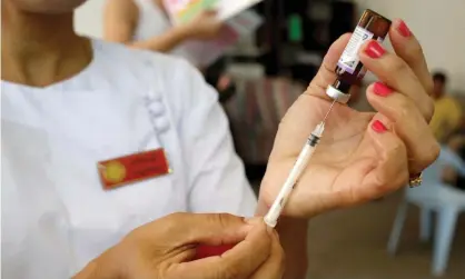  ??  ?? A nurse prepares a measles-rubella vaccine in Yangon, Myanmar. Photograph: Ann Wang/Reuters