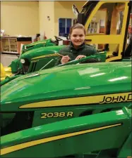  ?? SUBMITTED PHOTO ?? Grace Young preparing for the National Safe Tractor and Machinery Operation Program test at Cazenovia Equipment Company.