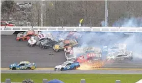  ?? PHELAN M. EBENHACK/ASSOCIATED PRESS ?? Denny Hamlin (11) gets caught up in a multi-car pileup. Hamlin survived a wild race featuring three wrecks and two red flag stoppages during the final 10 laps of regulation.