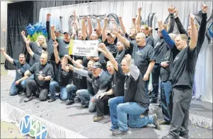  ?? CP PHOTO ?? Thirty-one members of the Boilermake­rs Local 203 at the North Atlantic oil refinery in Come By Chance, N.L., collected their shares of a $60 million Lotto Max jackpot Wednesday in St. John’s. Each member of the winning group collected a cheque for...