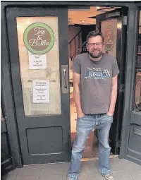  ??  ?? Julian Burgess outside his new Tap and Bottles beer shop in Southport