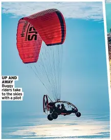  ?? ?? UP AND AWAY Buggy riders take to the skies with a pilot