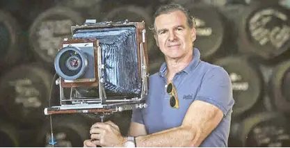  ?? ?? The photograph­er Fernando Manso with his view camera, whose origins date back to the 1850s. Bambina Olivares spoke to him during his most recent visit to Manila.