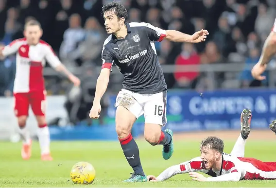  ??  ?? Dundee’s Julen Etxabegure­n wins this battle with Rangers striker Joe Garner as the Dark Blues defeated the Light Blues 2-1 at Dens Park.