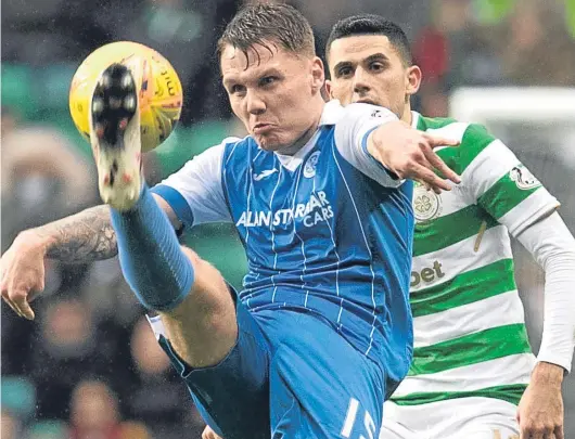  ?? Picture: SNS Group. ?? Saints defender Jason Kerr clears the ball away from Celtic comeback man Tom Rogic.