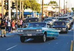  ?? NELVIN C. CEPEDA U-T FILE ?? Lowriders cruise down Highland Avenue on May 6, 2022, in National City. The activity saw a temporary legal return last year.