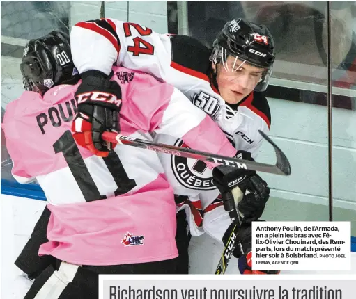  ??  ?? Anthony Poulin, de l’Armada, en a plein les bras avec Félix-Olivier Chouinard, des Remparts, lors du match présenté hier soir à Boisbriand.