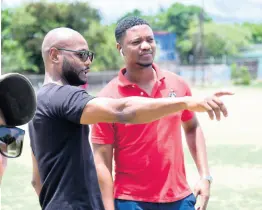  ?? ?? Boxing coach Sakima Mullings (left) and Christophe­r Jackson (Student, University of the West Indies Faculty of Sport) in dialogue as renovation­s were taking place at the Suga Knockout Boxing Gym at The Olympic Gardens Football Club yesterday.