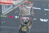  ?? ASHLEY LANDIS — THE ASSOCIATED PRESS ?? Warriors forward Andrew Wiggins dunks the ball during the first half against the Los Angeles Clippers in Los Angeles on Sunday.