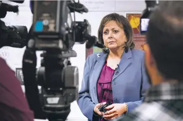  ?? GABRIELA CAMPOS/FOR THE NEW MEXICAN ?? Gov. Susana Martinez answers questions after a news conference Tuesday announcing her fiscal year 2018 budget proposal at MAS Charter School in Albuquerqu­e.