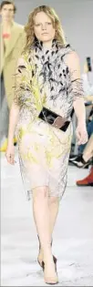  ?? Fernanda Calfat Getty Images ?? EMBELLISHM­ENT adorns a dress shown by Calvin Klein.