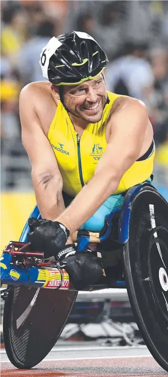  ?? Picture: AAP IMAGE ?? Kurt Fearnley looks across as Alexandre Dupont pips him on the finish line.