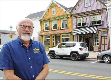  ?? CARLA ALLEN/TRICOUNTY VANGUARD ?? Yarmouth businessma­n Richard LeBlanc stands in front of two buildings he dramatical­ly transforme­d on Main Street.