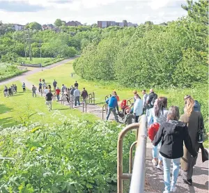  ?? Pictures: Kris Miller. ?? A week on from the discovery of Steven Donaldson’s body, an emotional gathering was held at a wooded area just off Aikman Road in Arbroath.