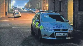  ??  ?? A police car parked on Benvie Road earlier this month.