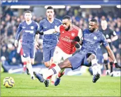  ?? AFP ?? Chelsea’s German defender Antonio Rudiger vies with Arsenal’s French striker Alexandre Lacazette during the English Premier League match between Chelsea and Arsenal at Stamford Bridge on Tuesday.