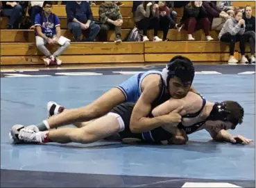  ?? MIKE CABREY — MEDIANEWS GROUP ?? North Penn’s Eddie Galang works on top of Quakertown’s Vinny DeSpirito during their 126-pound match Wednesday.