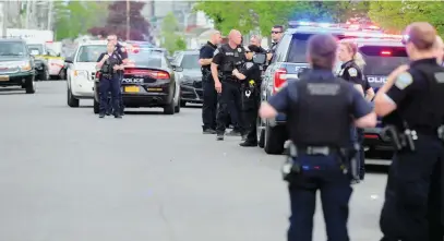  ?? Picture: AFP ?? ‘HATE CRIME’. Buffalo Police at a Tops Friendly Market on Saturday in Buffalo, New York. According to reports, at least 10 people were killed in a mass shooting at the store.