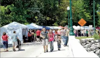  ?? File Photo ?? Dogwood Festival craft vendor booths will be extended along both sides of Sager Creek this year, including in front of the Masonic Lodge.