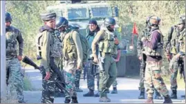  ?? ANI ?? Security personnel after two militants were killed in an encounter in Chukura area of Shopian on Wednesday.