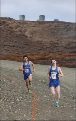  ?? ?? DOWNHILL— Bethel’s Ned Peters leads Nome’s Ben Milton on the way to the finish line. Peters finished in second place, Milton in fifth place.