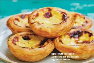  ??  ?? hot from the oven Sample the firm and flavourful egg tarts at bakeries