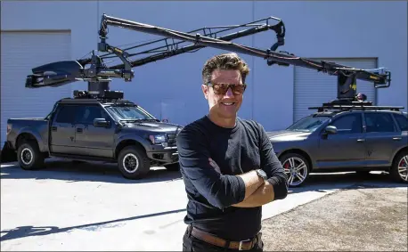  ?? GINA FERAZZI / LOS ANGELES TIMES ?? Award-winning automotive television commercial director Tim Damon uses giant Russian-made stabilized camera arms for his video shoots in Gardena, California. Digital ad spending by the U.S. automotive industry is expected to be $14 billion by 2020.