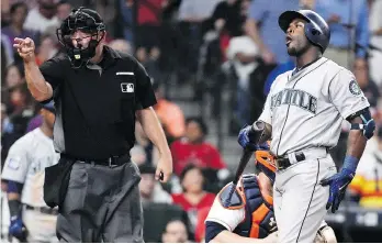  ?? ERIC CHRISTIAN SMITH/THE ASSOCIATED PRESS ?? Seattle Mariner Guillermo Heredia reacts to a called strike by home plate umpire Dan Bellino during Tuesday’s game against the Houston Astros. The Astros won 6-2.