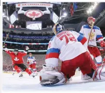  ??  ?? GOAL JOY: Patrice Bergeron (37) of Team Canada celebrates a third period goal by Brad Marchand (63) (not shown) against Sergei Bobrovsky (72) of Team Russia at the semifinal game during the World Cup of Hockey tournament at the Air Canada Centre on...