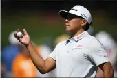  ?? MATT SLOCUM — THE ASSOCIATED PRESS ?? Chico's Kurt Kitayama warms up on the driving range during a practice round in preparatio­n for the Masters at Augusta National Golf Club on Monday in Augusta, Ga.