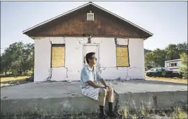  ??  ?? JENNER KIM of Trona, Calif., at his storage facility, which was badly damaged. The twin quakes were a reminder that in California, disaster is always possible.