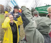  ?? WAYNE CUDDINGTON ?? Striking teachers react outside Algonquin College to the news the latest offer from the province has been rejected by fellow union members after voting for the last three days.