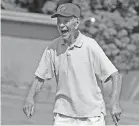  ?? CARDEW/AKRON BEACON JOURNAL] [MIKE ?? Ted Gaynor, who turns 98 next week, laughs at his own joke on the practice green at Spring Hills Golf Club in New Franklin near Akron on Wednesday. Gaynor plays 18 holes three times a week and recently carded an 89, a remarkable score for his age.