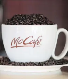  ?? SCOTT OLSON/GETTY IMAGES ?? McDonald’s Canada is opening two franchised McCafés this year that will serve an expanded lineup of regular and specialty coffee drinks, smoothies, sandwiches and upscale bakery staples such as croissants and muffins.