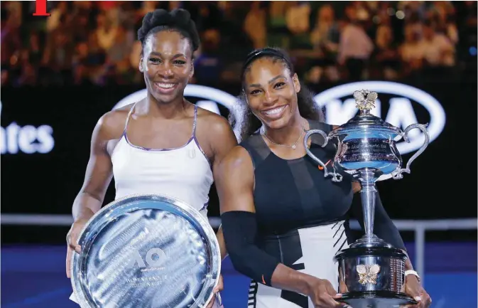  ??  ?? MELBOURNE: United States’ Serena Williams (right) and her sister Venus pose for a photo after Serena won the women’s singles final at the Australian Open tennis championsh­ips yesterday. — AP