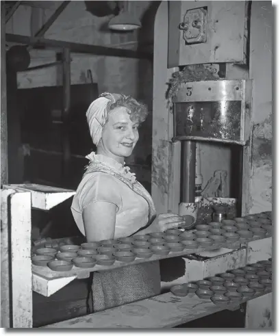  ??  ?? May 1958 ... A female pottery worker moulding flower pot saucers