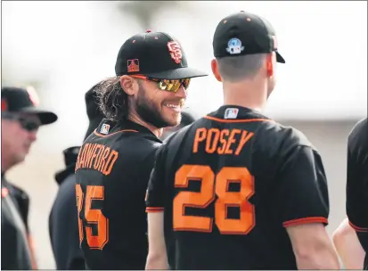 ?? RANDY VAZQUEZ — BAY AREA NEWS GROUP, FILE ?? The Giants’ Brandon Crawford, left, smiles while talking to teammate Buster Posey during spring training in Scottsdale, Ariz., on Feb. 21.