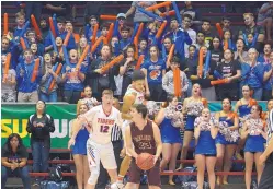  ?? GREG SORBER/ JOURNAL ?? Los Lunas fans yell for their team and smack together thundersti­cks during the 5A state semifinal game against rival Belen in the Pit on Thursday. Belen rallied for a 50-41 victory over the Tigers.