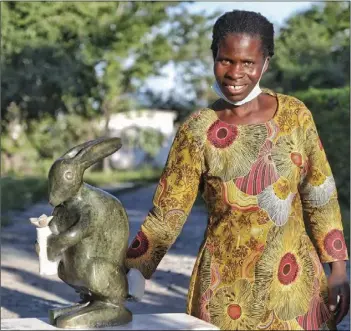  ?? ?? Sabelo Zibengwa, a sculptor at Chitungwiz­a Arts Centre had her piece selected for the Hand-up Stone Art Project