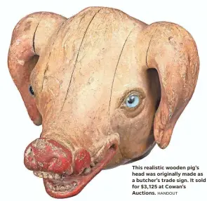  ?? HANDOUT ?? This realistic wooden pig’s head was originally made as a butcher’s trade sign. It sold for $3,125 at Cowan’s Auctions.